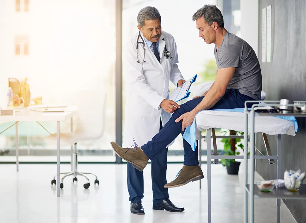 Image of a man and a doctor at a men's health clinic